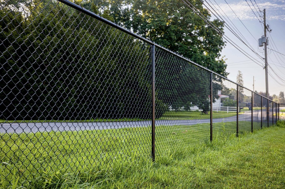 Black chain-link fence installation in Ivins, UT for residential property security