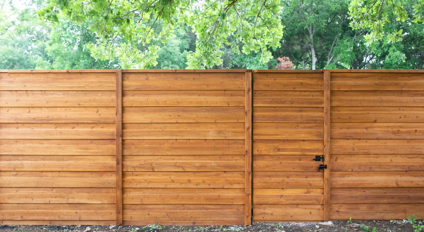 New fence installation service in Ivins, UT featuring modern horizontal wood slat design