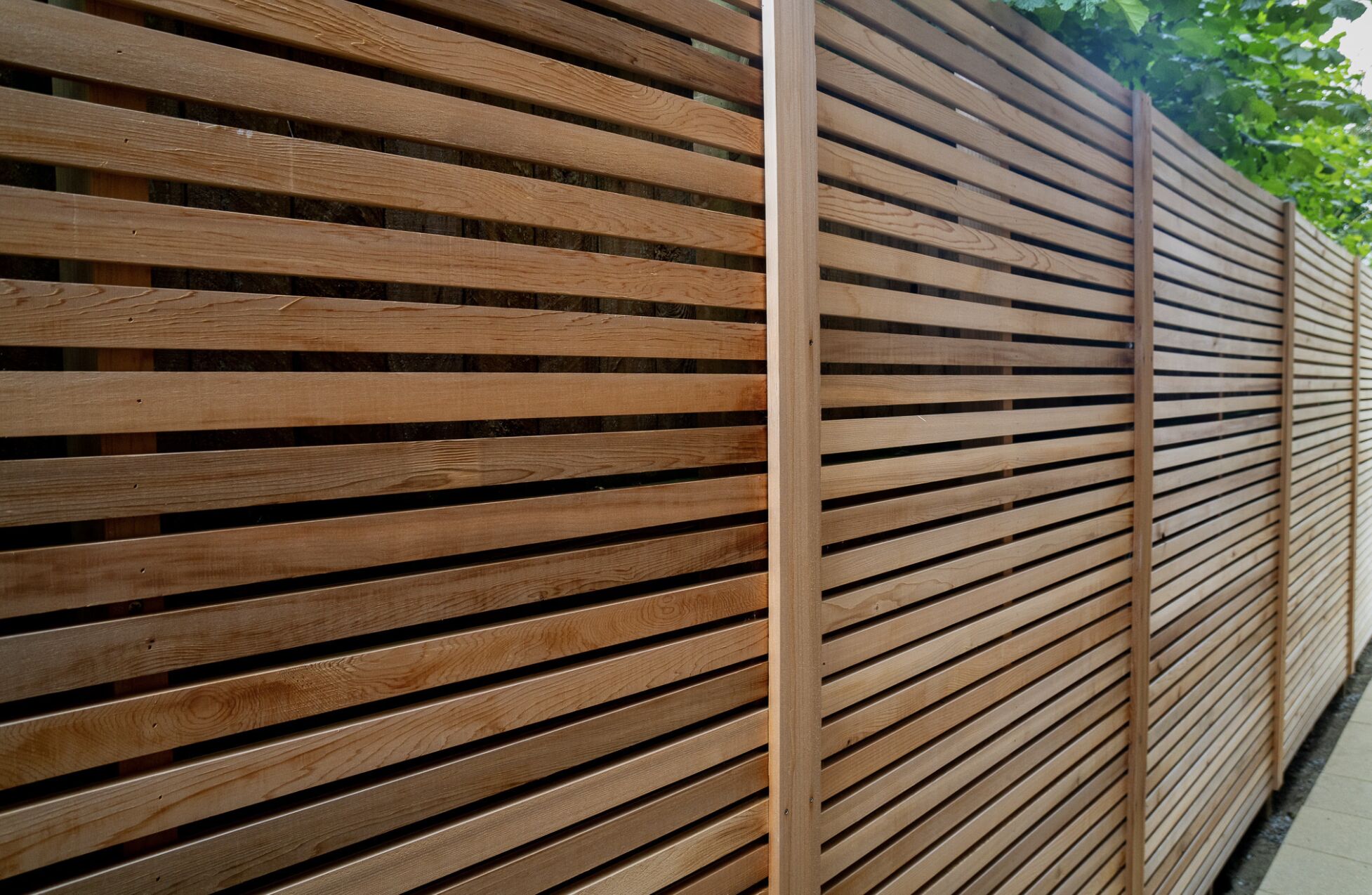 Modern horizontal slat fence installation in Ivins, UT with clean contemporary design